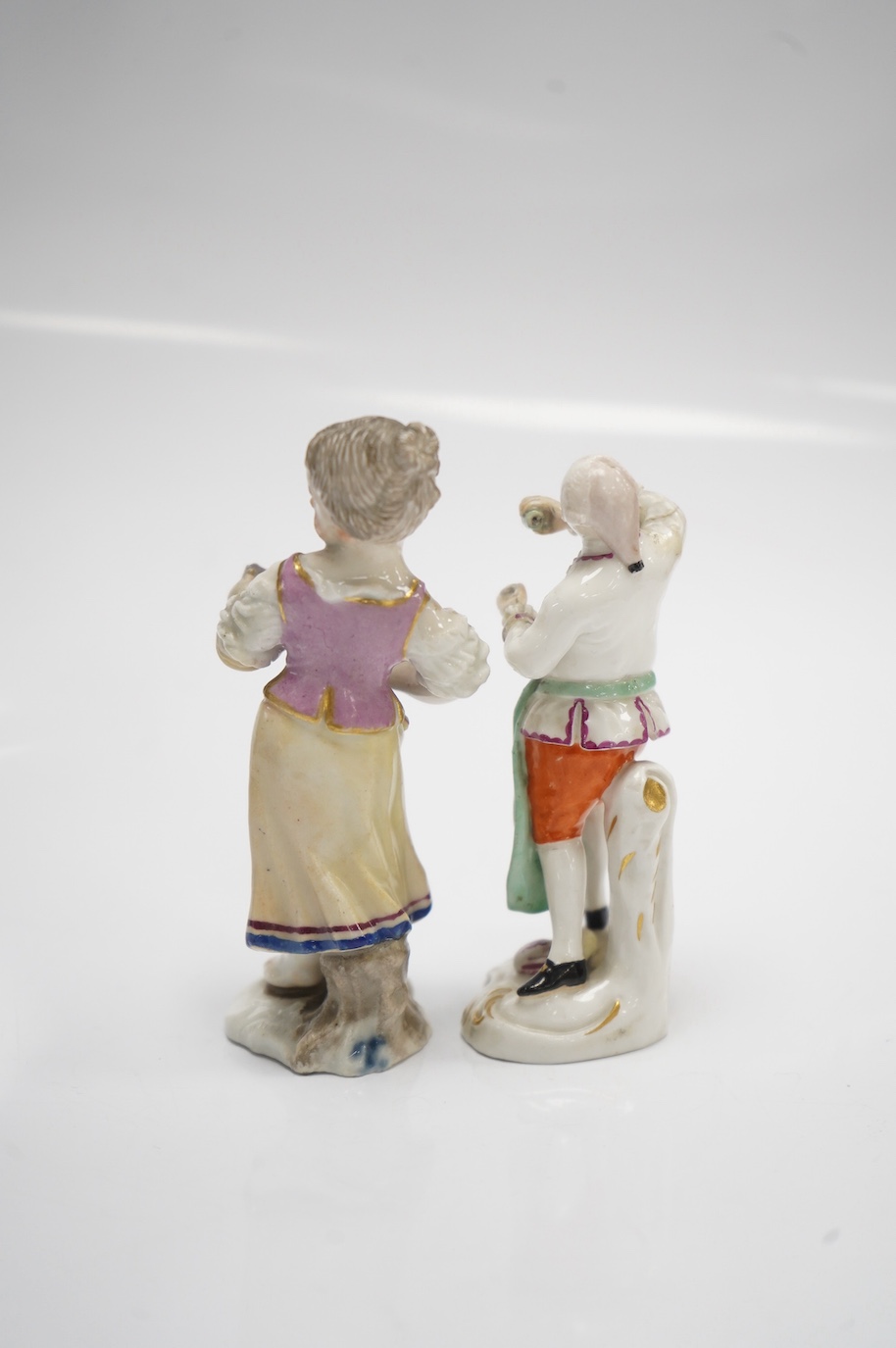 Two 19th century German porcelain figures, Hochst and Buen Retiro style marks, 9.5cm. Condition - fair